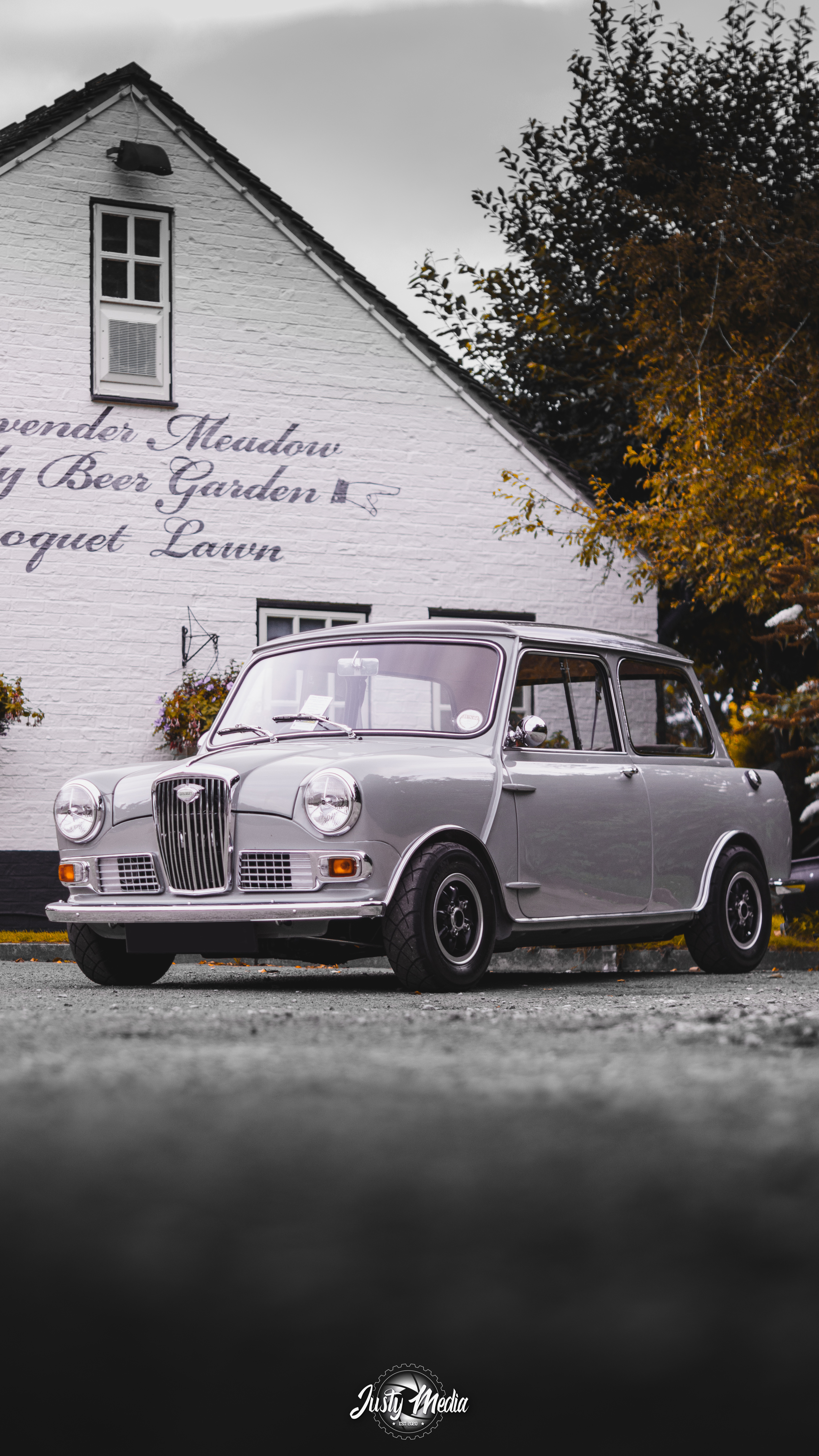 Classic Mini photographed outside a white building